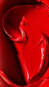 Texture rouge à lèvre réalisée dans le carde d'une campagne de publicité pour une marque de luxe cosmétique